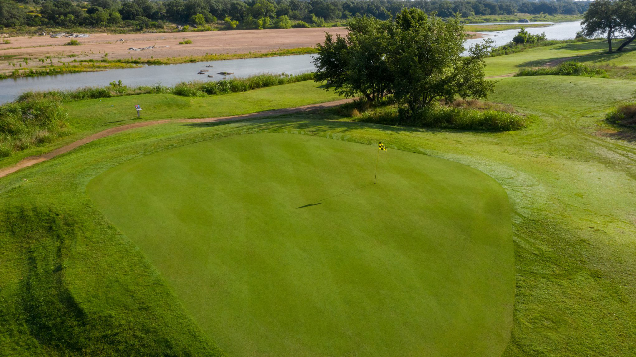 Alternate view of well-manicured green with checkered flag pin